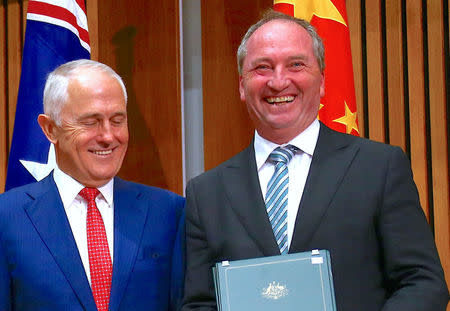 Australia's Prime Minister Malcolm Turnbull stands next to Barnaby Joyce, Australia's Deputy Prime Minister and Minister for Agriculture and Water Resources, during an official signing ceremony at Parliament House in Canberra, Australia March 24, 2017. REUTERS/David Gray