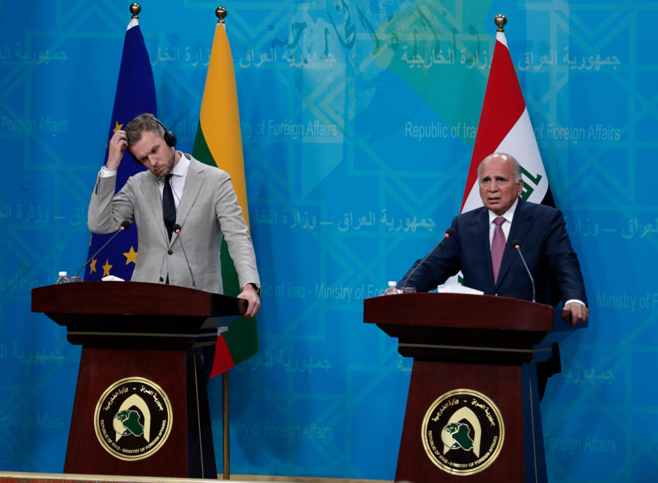 Iraqi Foreign Minister Fouad Hussein, right, and visiting Lithuanian Foreign Minister Gabrielius Landsbergis, hold a news conference following their meeting, in Baghdad, Iraq, Thursday, July 15, 2021. (AP Photo/Khalid Mohammed)