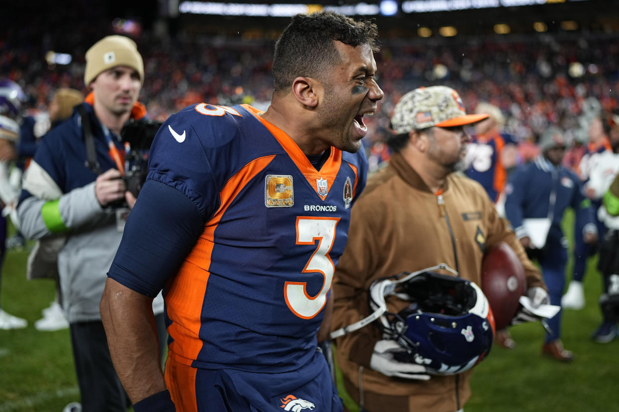 Denver Broncos quarterback Russell Wilson celebrates after the Broncos defeated the Vikings 21-20. (AP Photo/Jack Dempsey)