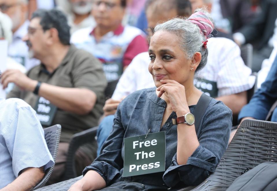 Booker Prize winner Arundhati Roy attends a protest at a press club in New Delhi on Wednesday (4 October) (EPA)
