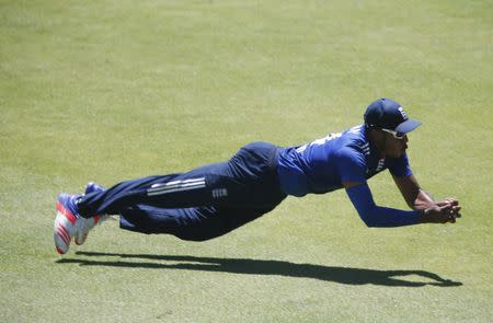 England's Chris Jordan takes a catch to dismiss South Africa's AB de Villiers during their second One-Day International cricket match in Port Elizabeth, February 6, 2016. REUTERS/Mike Hutchings