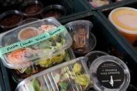 Food items being donated to employees of Farley’s East cafe, that closed due to the financial crisis caused by the coronavirus disease (COVID-19), that were laid off at the cafe are seen in crates in Oakland, California