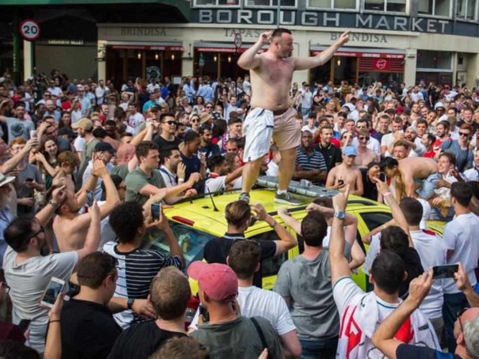 This man, who police have not identified, danced on the roof with his top off