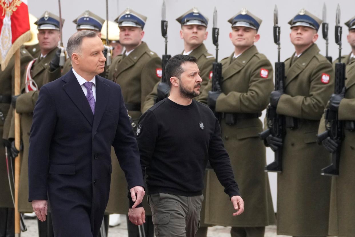 Poland's President Andrzej Duda, left, welcomes Ukrainian President Volodymyr Zelenskyy as they meet at the Presidential Palace in Warsaw, Poland (AP)