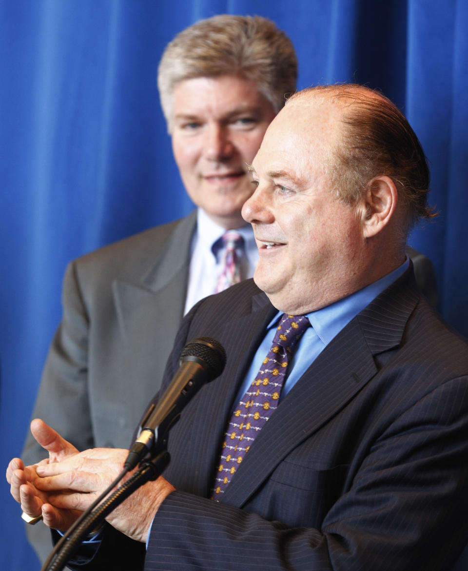 Chicago coin and antiques dealer Harlan Berk, accompanied by Chicago FBI Assistant Special Agent-in-Charge Michael Kosanovich, speaks at a news conference Wednesday, June 20, 2012, in Chicago as more than 120 stolen artifacts missing for decades _ including letters with the signatures of Abraham Lincoln, Thomas Jefferson and American Revolution hero Thaddeus Kosciuszko _ were returned to Chicago's Polish Museum of America by the FBI. The items include letters and documents dating to the 18th and 19th centuries, seals, military medals and Nazi propaganda from World War II. The pieces, which the FBI valued at about $5 million, also included documentation about Napoleon, George Washington, John Adams and Polish kings. FBI officials say the pieces only resurfaced last October, when Berk notified the museum that his office had purchased historic items that it had traced to the institution. (AP Photo/M. Spencer Green)