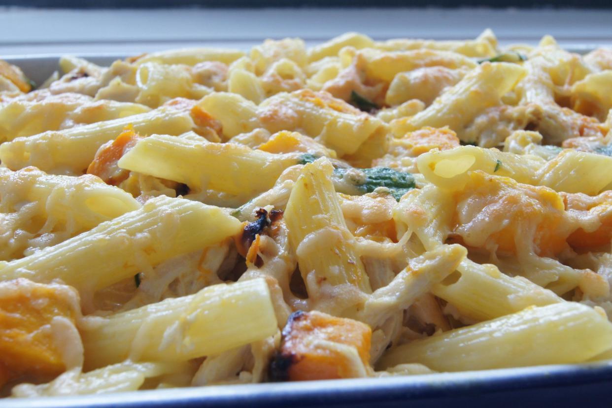 Chicken Pasta Bake with pieces of pumpkin in a baking dish