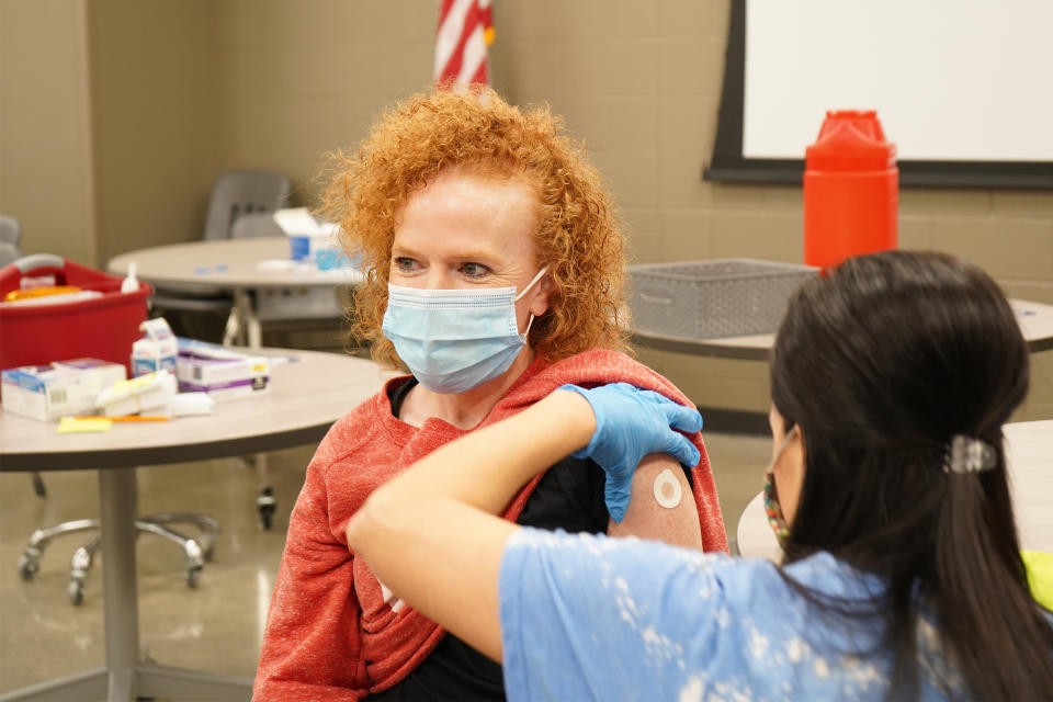 Pharmacist Megan Wilson administers the Covid-19 vaccine to Coach Emily Grimmett in Sheridan, Ark., earlier this year. McCoy-Tygart Drug, a community pharmacy, held a vaccine clinic to help inoculate teachers in the local school district. (McCoy-Tygart Drug)