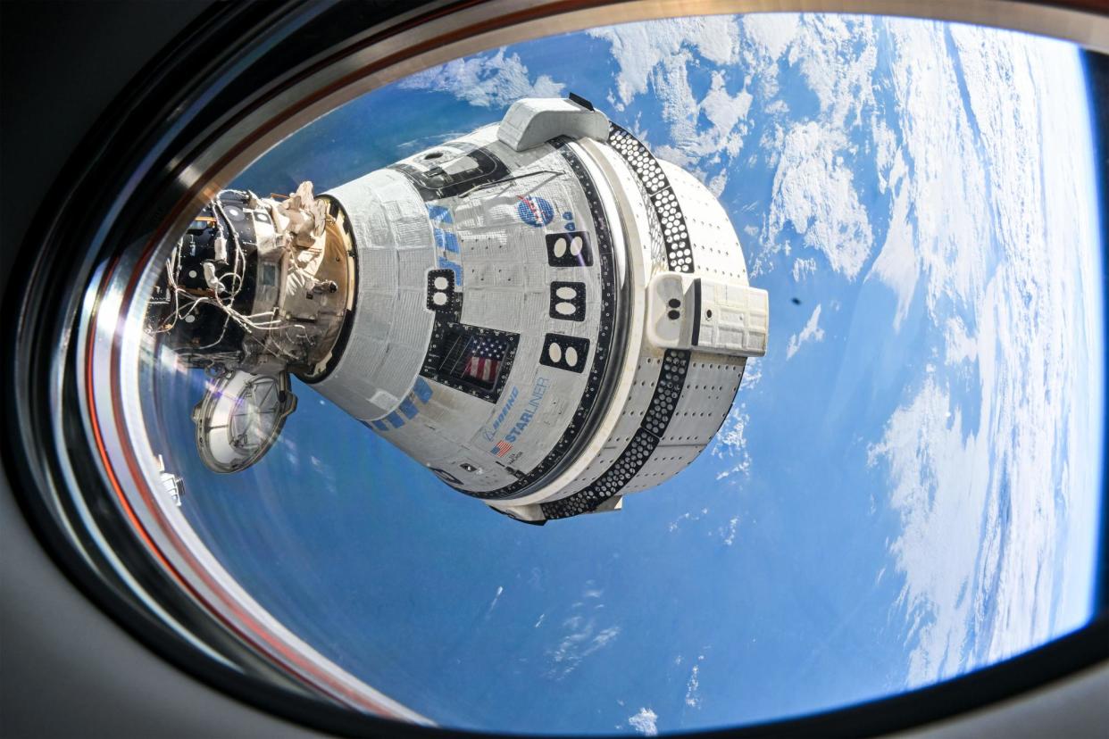 <span>The Boeing Starliner craft docked to the International Space Station.</span><span>Photograph: NASA</span>