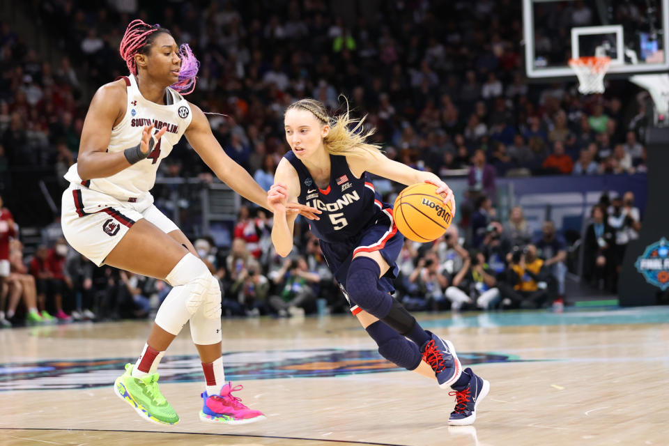 UConn's Paige Bueckers drives to the basket against South Carolina's Aliyah Boston during the NCAA women's championship gamw on April 3, 2022 at Target Center in Minneapolis. Neither player will be selected in the 2022 WNBA draft because of eligibility requires for the pro league. (C. Morgan Engel/NCAA Photos via Getty Images)