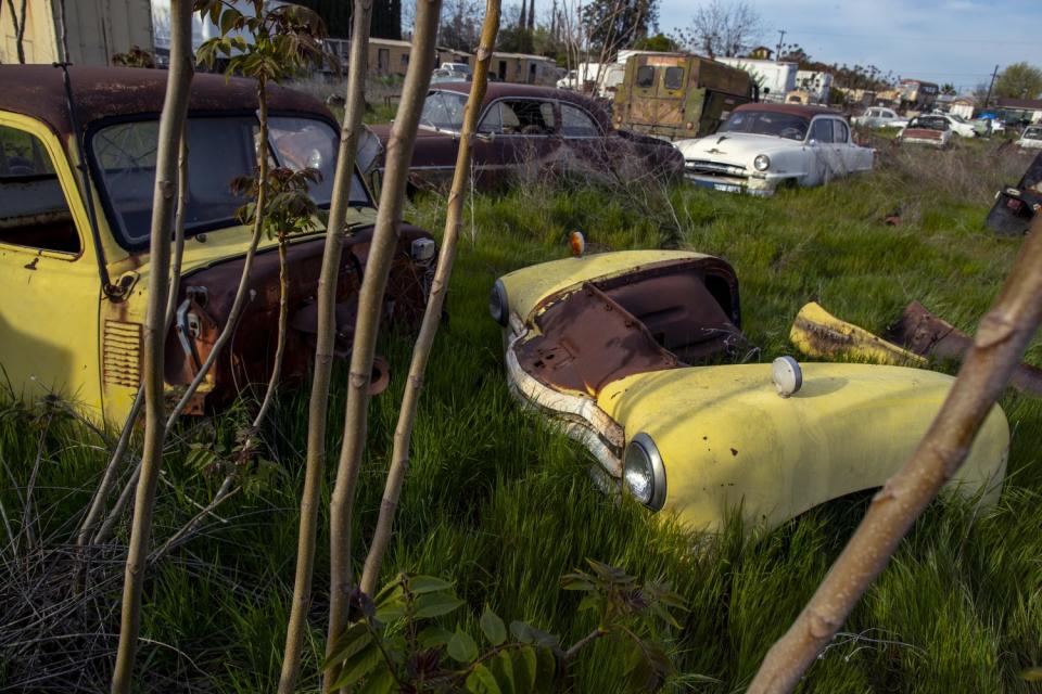 Old cars, junk and antiques on a lot in Turlock.