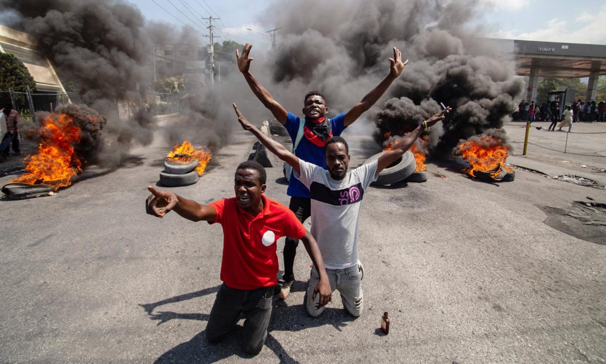 <span>Protesters set fire to tyres in Port-au-Prince on Tuesday, the day Haiti’s prime minister, Ariel Henry, resigned after weeks of street protests and a violent gang uprising.</span><span>Photograph: David Lorens Mentor/Sipa/Rex/Shutterstock</span>