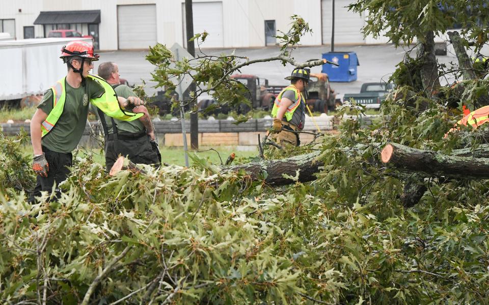 Whitefield Fire Station of Anderson County remove a fallen tree from US 29 near the Jockey Lot, during Tropical Storm Helene in Williamston, S.C. Friday, September 27, 2024.