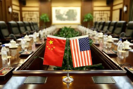 Flags of U.S. and China are placed for a meeting between Secretary of Agriculture Sonny Perdue and China's Minister of Agriculture Han Changfu at the Ministry of Agriculture in Beijing, China June 30, 2017. REUTERS/Jason Lee/Files