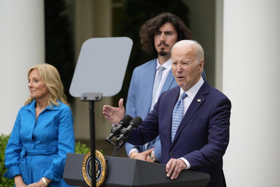 President Joe Biden speaks as first lady Jill Biden and Miami Heat basketball player Jaime Jaquez Jr., listen during a Cinco de Mayo reception in the Rose Garden of the White House, Monday, May 6, 2024, in Washington. (AP Photo/Alex Brandon)