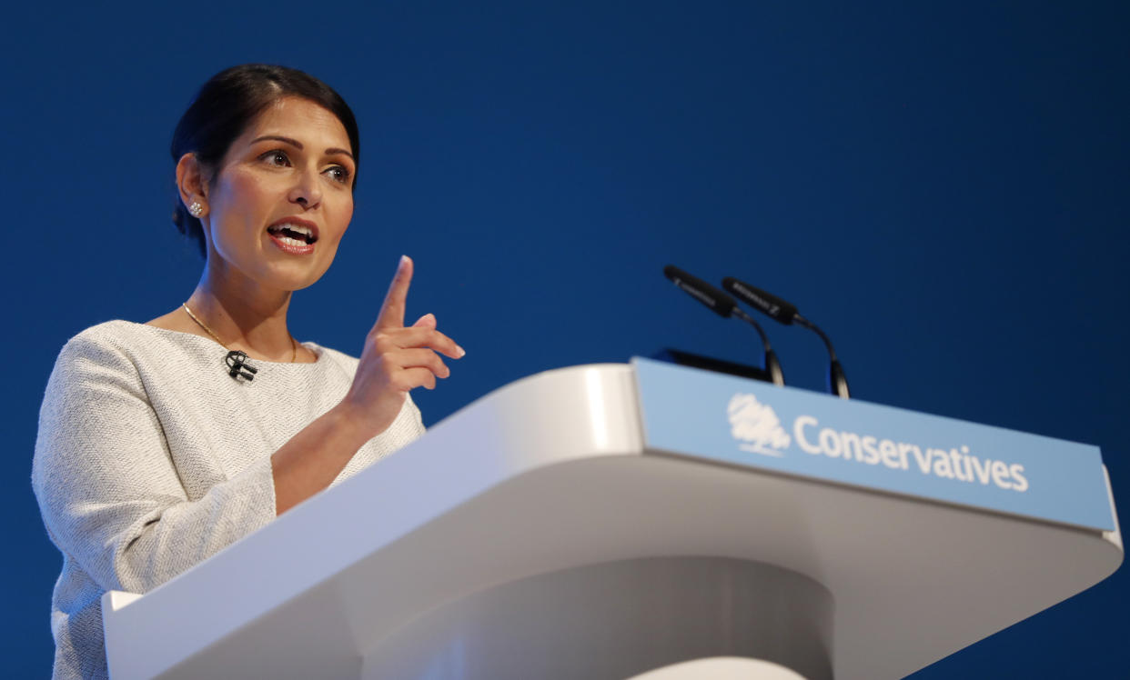 Britain's Home Secretary Priti Patel addresses the delegates at the Conservative Party Conference in Manchester, England, Tuesday, Oct. 1, 2019.   Britain's ruling Conservative Party is holding their annual party conference.(AP Photo/Frank Augstein)