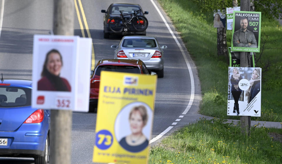 Campaign posters of the municipal elections on the roadside in Espoo, Finland, on May 25, 2021. Finland holds local elections upcoming Sunday June 13, 2021, in a first litmus test for the popular young Social Democratic prime minister, Sanna Marin, who took office a mere 18 months ago. (Heikki Saukkomaa/Lehtikuva via AP)