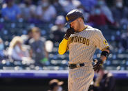 San Diego Padres' Victor Caratini crosses home plate after hitting a grand slam off Colorado Rockies relief pitcher Robert Stephenson in the sixth inning of game one of a baseball doubleheader Wednesday, May 12, 2021, in Denver. (AP Photo/David Zalubowski)