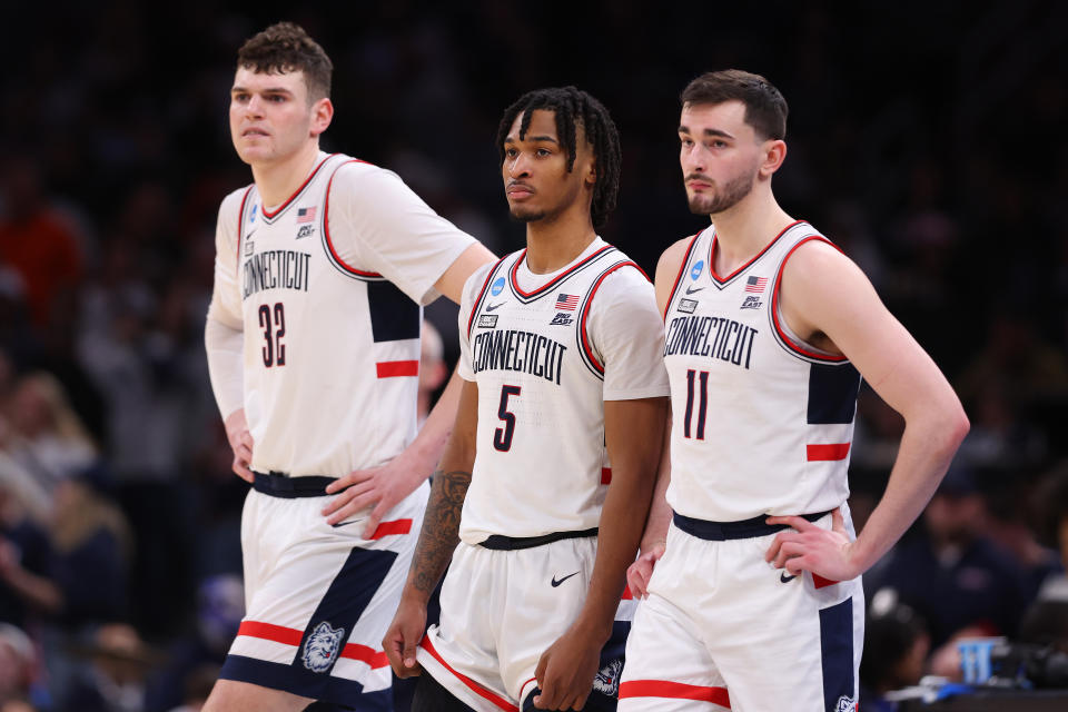 Donovan Clingan #32, Stephon Castle #5 and Alex Karaban #11 of the Connecticut Huskies in Elite 8 round of the NCAA Men's Basketball Tournament March 30.