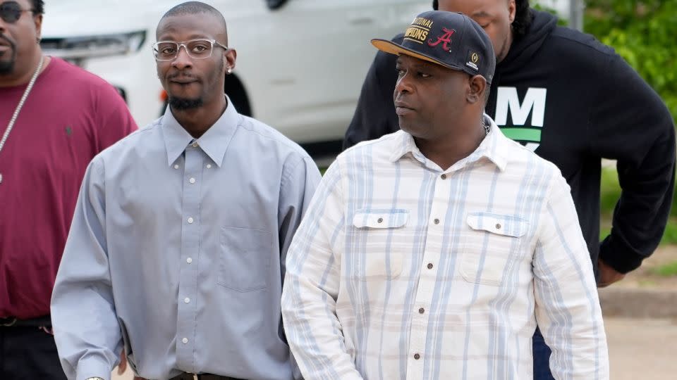 Michael Corey Jenkins, left, and Eddie Terrell Parker walk toward the Thad Cochran United States Courthouse in Jackson, Mississippi, on Thursday. - Rogelio V. Solis/AP