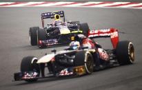 Toro Rosso Formula One driver Daniel Ricciardo of Australia (front) drives ahead of Red Bull Formula One driver Mark Webber of Australia during the second practice session of the Indian F1 Grand Prix at the Buddh International Circuit in Greater Noida, on the outskirts of New Delhi, October 25, 2013. REUTERS/Anindito Mukherjee (INDIA - Tags: SPORT MOTORSPORT F1)