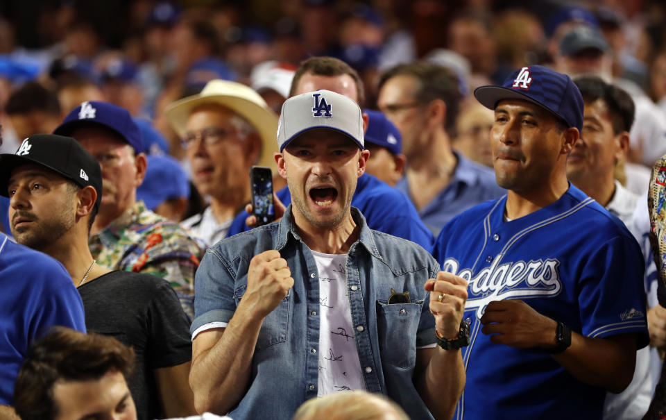 <p>Justin Timberlake celebrates after Joc Pederson #31 of the Los Angeles Dodgers hits a home run in the fifth inning of Game 2 of the 2017 World Series against the Houston Astros at Dodger Stadium on Wednesday, October 25, 2017 in Los Angeles, California. (Photo by Alex Trautwig/MLB Photos via Getty Images) *** Local Caption *** Justin Timberlake </p>
