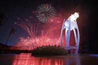 <p>Fireworks explode behind the Olympic flame during the opening ceremony of the 2018 Winter Olympics in Pyeongchang, South Korea, Friday, Feb. 9, 2018. (AP Photo/David J. Phillip,Pool) </p>