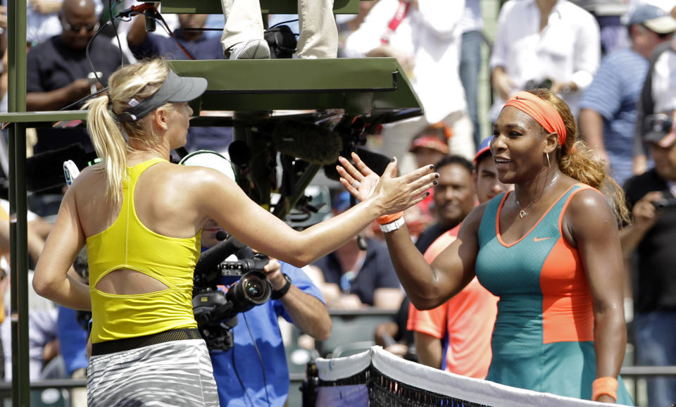 Maria Sharapova, of Russia, left, congratulates Serena Williams at the Sony Open tennis tournament in Key Biscayne, Fla., Thursday, March 27, 2014. Willaims won 6-4, 6-3. (AP Photo/Alan Diaz)