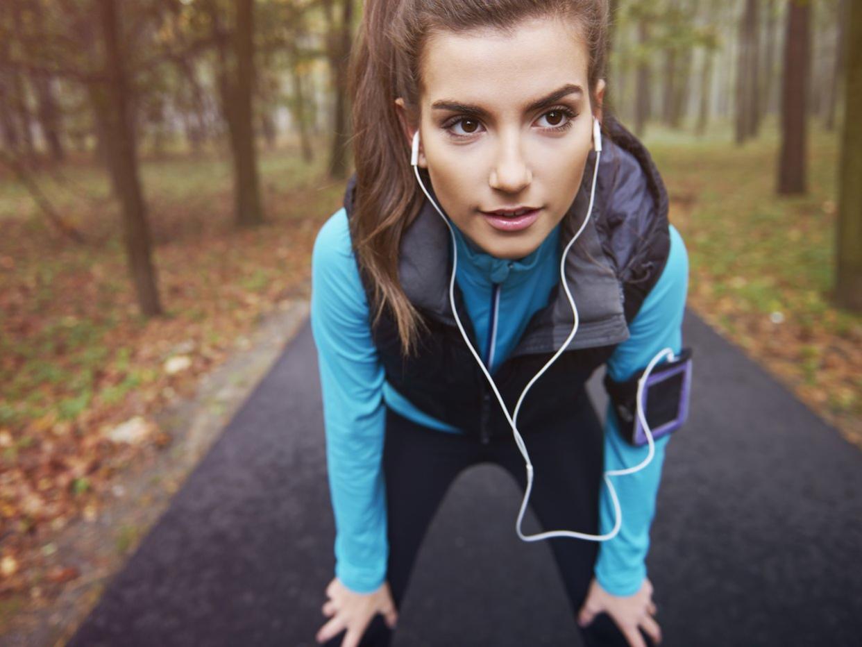 woman running outdoors fall park leaves exercise run jog