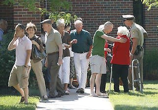 Parishioners leave Wichita's Reformation Lutheran Church in 2009 after abortion provider George Tiller was shot there earlier in the day.