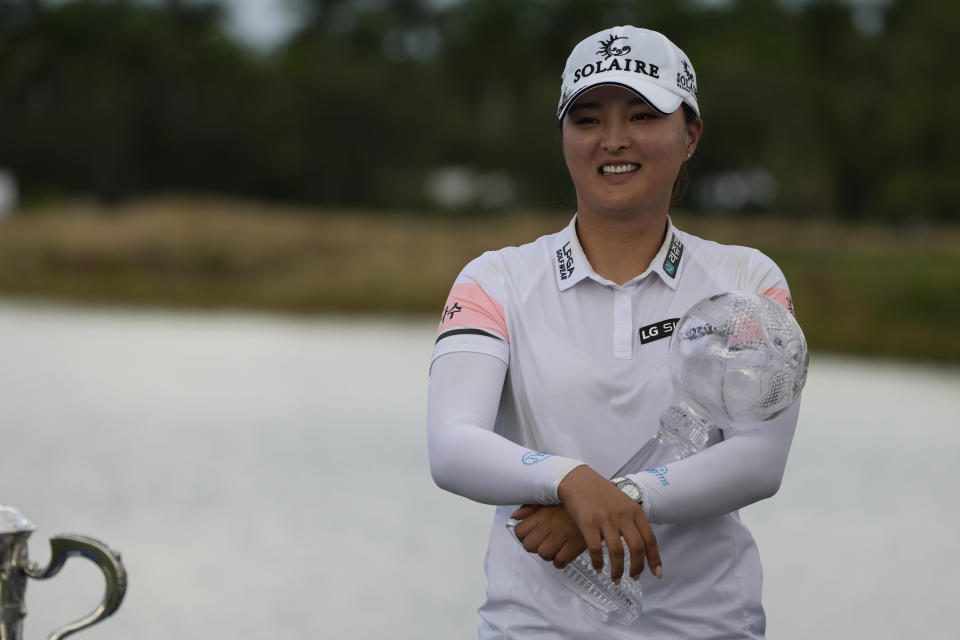 Jin Young Ko, of Korea, holds the winners trophy after winning the LPGA Tour Championship golf tournament, Sunday, Nov. 21, 2021, in Naples, Fla. (AP Photo/Rebecca Blackwell)