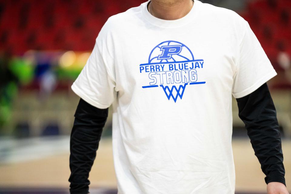 "Perry Strong" shirts were worn by Saydel players on Tuesday at Wells Fargo Arena in Des Moines.