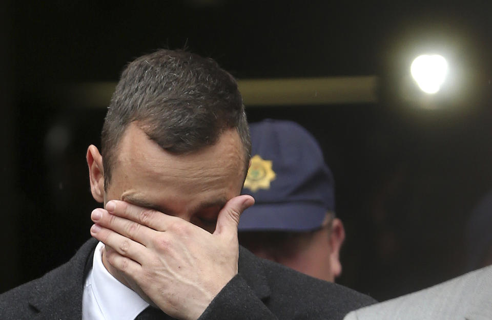 Oscar Pistorius, leaves the high court in Pretoria, South Africa, Monday, April 14, 2014. Pistorius is charged with murder for the shooting death of his girlfriend, Reeva Steenkamp, on Valentines Day in 2013. (AP Photo/Themba Hadebe)