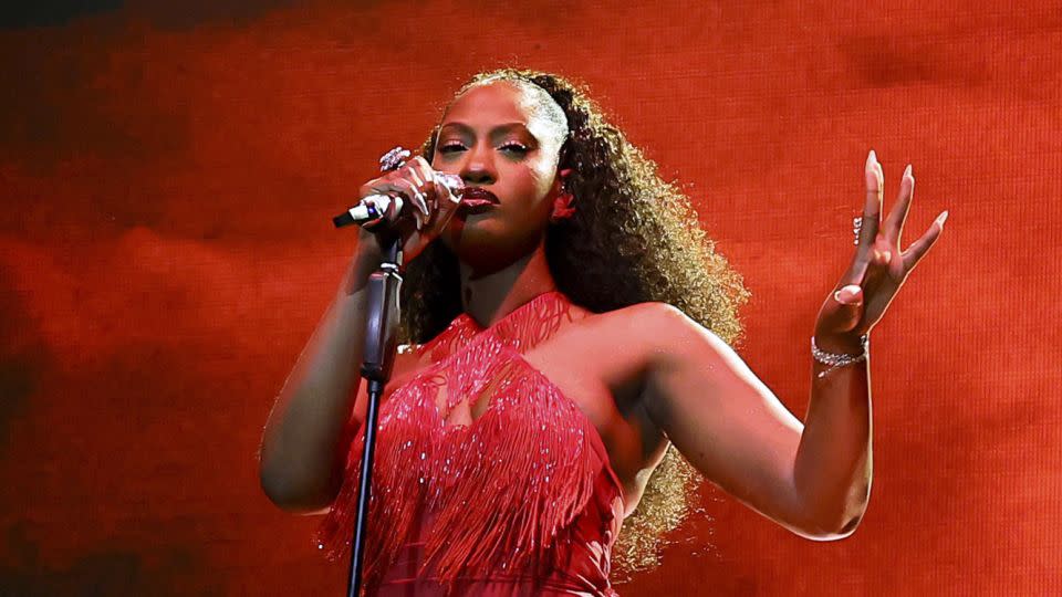 At the Mojave Tent during the second weekend, Tems performed in a embellished ruby-red dress with fringe detailing. - Theo Wargo/Getty Images North America/Getty Images for Coachella