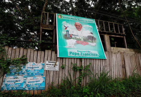 A banner showing Pope Francis hangs outside a home in Puerto Maldonado, ahead of the papal's visit to Peru, January 18, 2018. REUTERS/Henry Romero