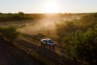 A U.S. Customs and Border Protection vehicle rides on a dirt road near the Del Rio International Bridge, Friday, Sept. 24, 2021, in Del Rio, Texas. (AP Photo/Julio Cortez)