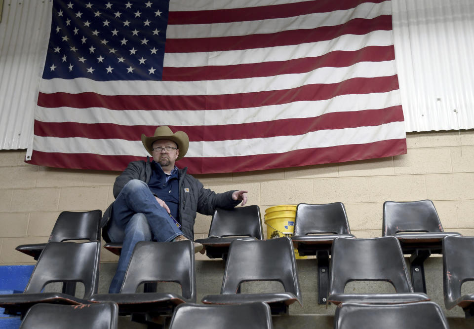 FILE - Mark Moorman bids on cattle during an auction in Brush, Colo., on Jan. 11, 2024. Rep. Lauren Boebert, R-Colo., left her competitive 3rd District race to compete instead in the safer Republican 4th District, which encompasses Brush, for the Tuesday, June 25, state primary. Since her election in 2020, Boebert has become a polarizing figure for her combative style and penchant for controversy, but likely improved her chances at reelection with the move to a district that former President Donald Trump carried twice. (AP Photo/Thomas Peipert, File)