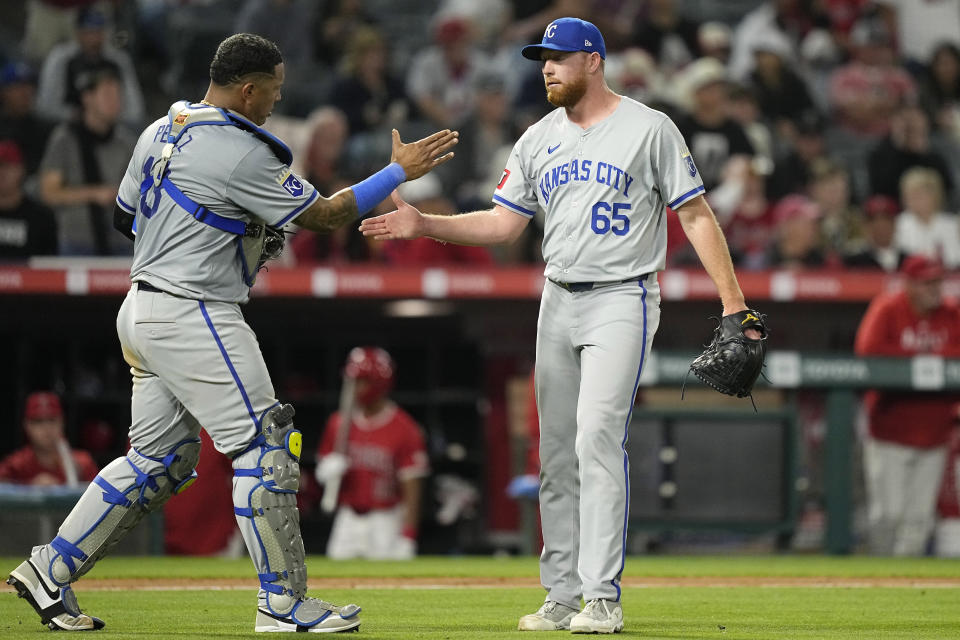 Kansas City Royals catcher Salvador Perez, left, and relief pitcher Matt Sauer congratulate each other after the Royals defeated the Los Angeles Angels 10-4 in a baseball game Thursday, May 9, 2024, in Anaheim, Calif. (AP Photo/Mark J. Terrill)