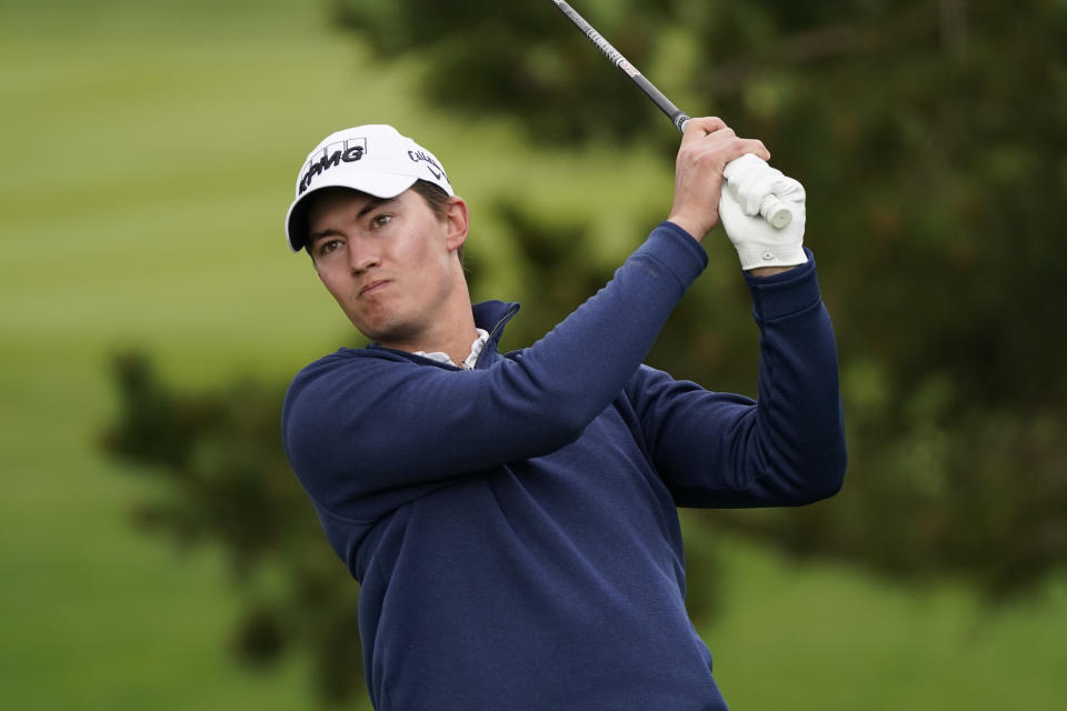 Maverick McNealy follows his drive from the second tee of the Pebble Beach Golf Links during the final round of the AT&T Pebble Beach Pro-Am golf tournament Sunday, Feb. 14, 2021, in Pebble Beach, Calif. (AP Photo/Eric Risberg)