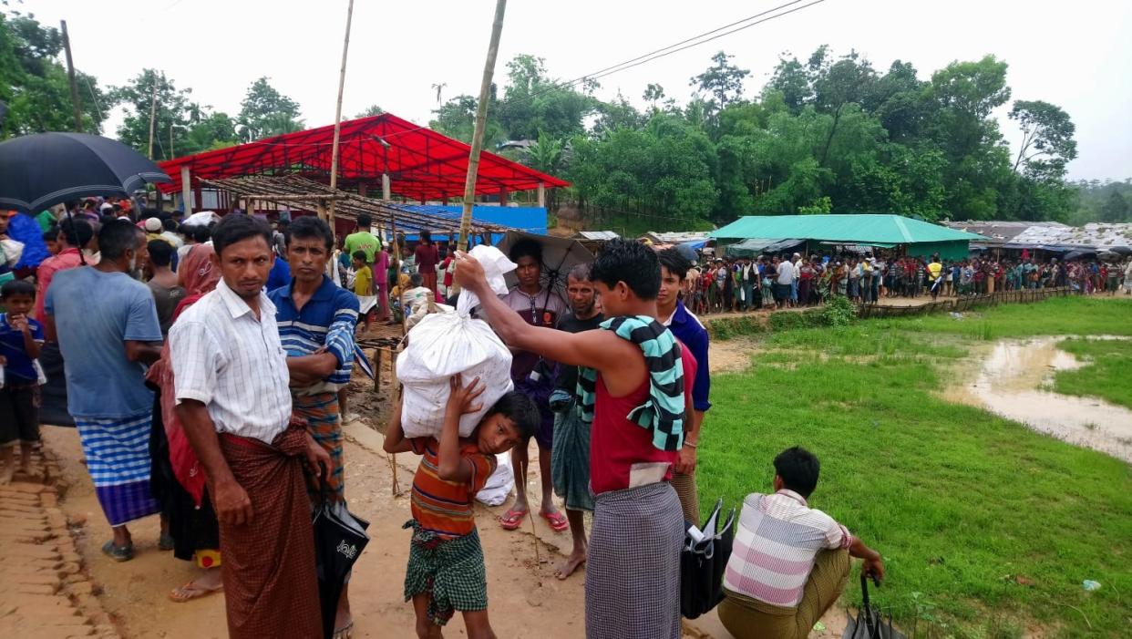 A long line of Rohingya refugees forms at Hakimpara Camp 14, as a United Nations food truck arrives to provide rations in July 2018. PHOTO: Shoshanna Chua