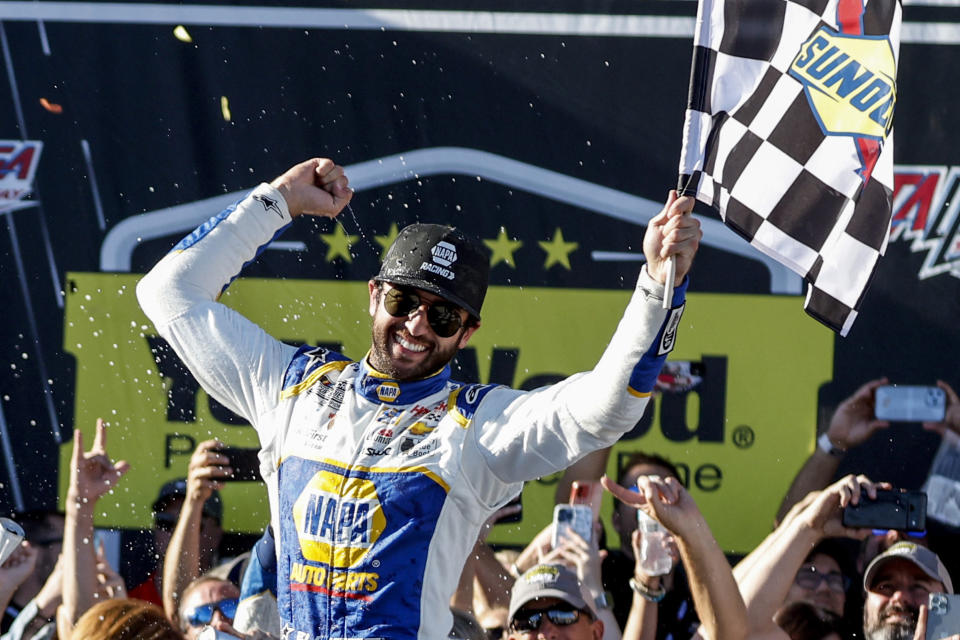 Chase Elliott celebrates in Victory Lane after winning a NASCAR Cup Series auto race, Sunday, Oct. 2, 2022, in Talladega, Ala. (AP Photo/Butch Dill)