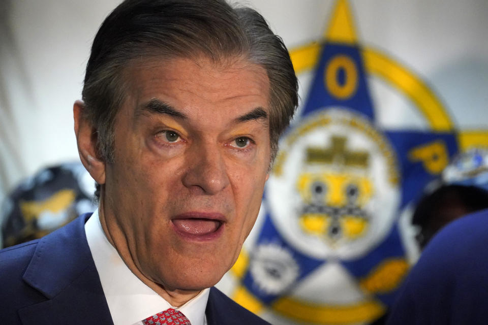 FILE - Dr. Mehmet Oz, Republican candidate for U.S. Senate in Pennsylvania, visits the Fraternal Order of Police Lodge 91 in West Homestead, Pa., Oct. 18, 2022. Fetterman is releasing a new doctor’s note saying that he's recovering well from a May stroke as he vies for Pennsylvania’s pivotal U.S. Senate seat. (AP Photo/Gene J. Puskar, File)