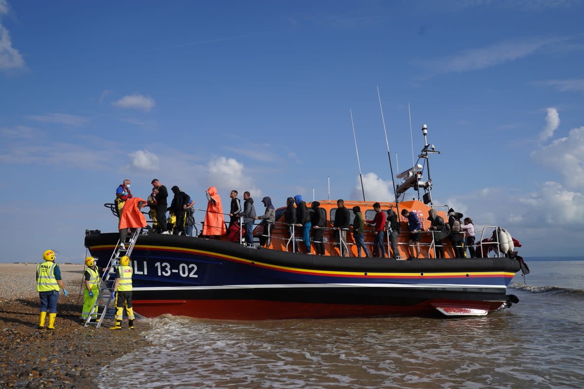 A group of people thought to be migrants are brought in to Dungeness, Kent, onboard an RNLI Lifeboat following a small boat incident in the Channel. Picture date: Saturday August 27, 2022. (Gareth Fuller/PA) (PA Wire)