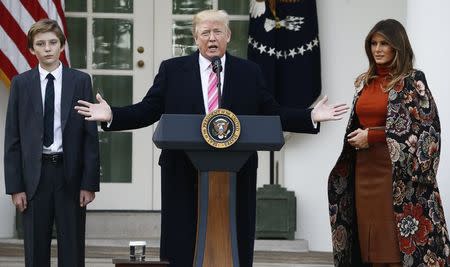 U.S. President Donald Trump speaks as his son Barron and first lady Melania Trump listen during the 70th National Thanksgiving turkey pardoning ceremony in the Rose Garden of the White House in Washington, U.S., November 21, 2017. REUTERS/Jim Bourg