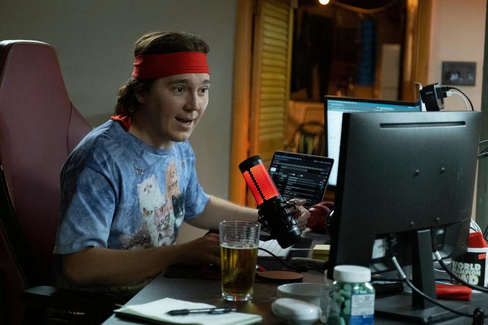 Keith Gill (Paul Dano) livestreams from his basement in a scene from "Dumb Money."
