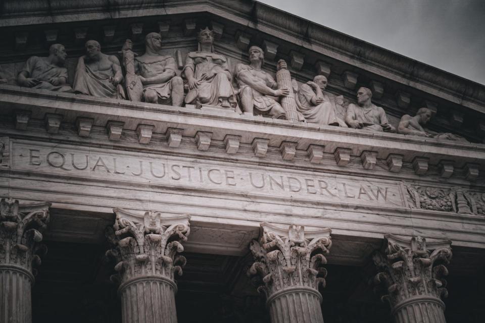 The U.S. Supreme Court will rule on Trump’s immunity claims. <a href="https://www.gettyimages.com/detail/photo/supreme-court-royalty-free-image/1395276664?phrase=Supreme+Court&adppopup=true" rel="nofollow noopener" target="_blank" data-ylk="slk:Jason Sanderford/iStock / Getty Images Plus;elm:context_link;itc:0;sec:content-canvas" class="link ">Jason Sanderford/iStock / Getty Images Plus</a>