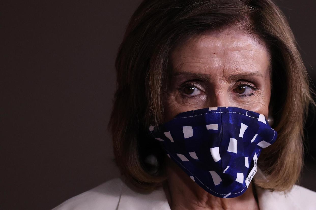 WASHINGTON, DC - APRIL 30: Speaker of the House Nancy Pelosi (D-CA) wears a cloth mask to cover her mouth and nose to prevent the spread of the novel coronavirus during her weekly news conference at the U.S. Capitol April 30, 2020 in Washington, DC. While she and Democratic House leaders are not going to reconvene next week due to the COVID-19 pandemic, she said committee chairs are working on the next piece of economic rescue legislation. (Photo by Chip Somodevilla/Getty Images)