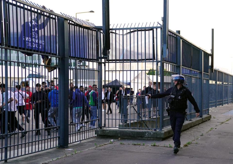 Police use pepper spray against fans outside the ground (Adam Davy/PA) (PA Wire)