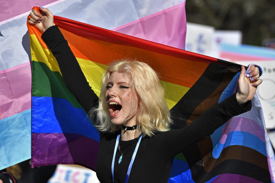 A girl shouts in support of protesters of Kentucky Senate bill SB150, known as the Transgender Health Bill, gathered on the lawn of the Kentucky State Capitol in Frankfort, Ky., Wednesday, March 29, 2023. (AP Photo/Timothy D. Easley)