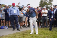 Louis Oosthuizen, of South Africa, drops the ball on the 14th fairway during the final round of the U.S. Open Golf Championship, Sunday, June 20, 2021, at Torrey Pines Golf Course in San Diego. (AP Photo/Jae C. Hong)