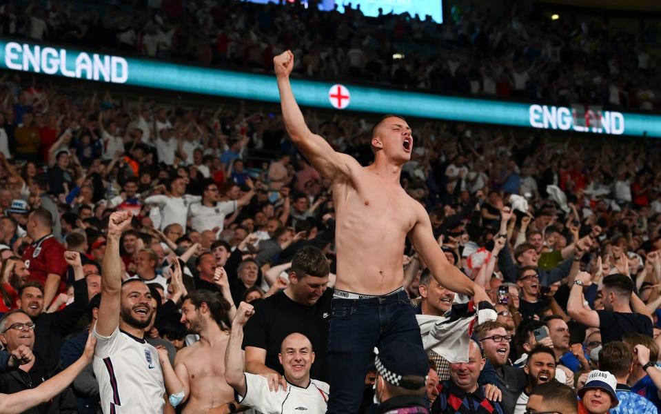  A fan of England celebrates their side's second goal scored by Harry Kane  -  Paul Ellis - Pool/Getty Images